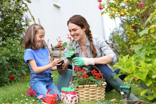 Gardener inspecting a residential garden path before starting work